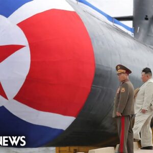 Kim Jong Un launching new submarine shown on North Korean TV